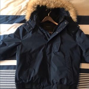 Andrew Marc navy puffer coat with fur hood.